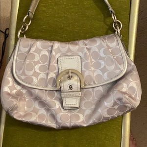 Silver coach bag.